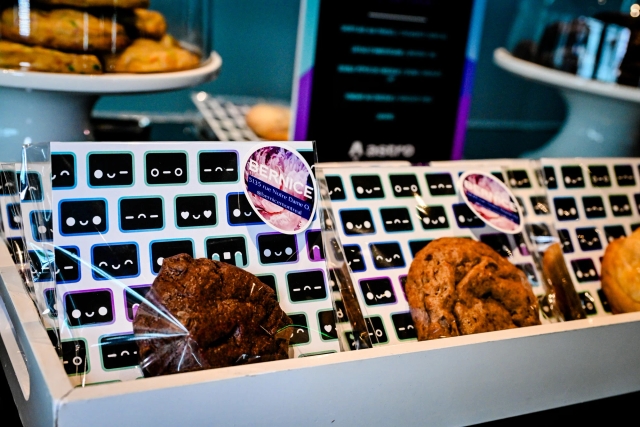 Closeup of cookies at the gourmet cookie bar. The cookie bags are clear with Houston patterned inserts. The bags are branded with Bernice, a bakery.