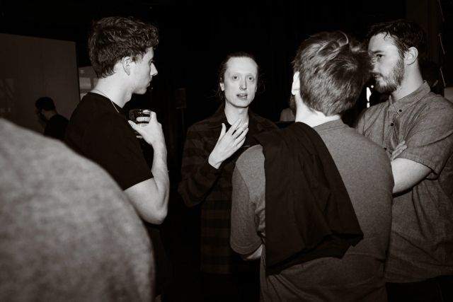 Black and white photo of Chris Swithinbank, from Astro, speaking to guests.